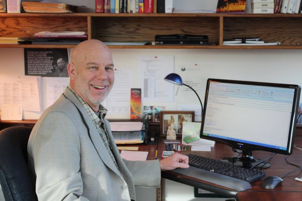 CityU Faculty Member Michael Theisen working at his desk
