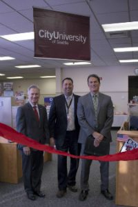 Randy Fisch, Matt Hanusa and Vice President of Academics and Kurt Kirstein at the ribbon cutting for the new City University of Seattle site at Joint Base Lewis-McChord