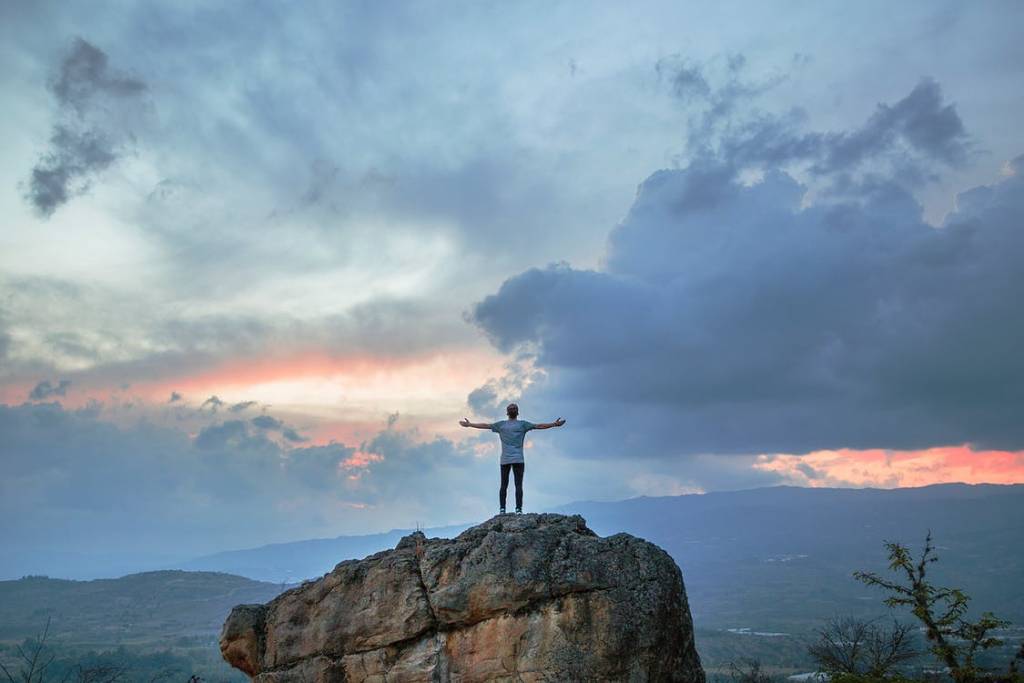 Person standing on large rock