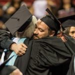 CityU Graduates hugging each other