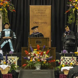 President Frisch looks out at graduates