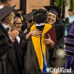 Graduates Hugging