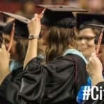 Graduates Holding Tassle
