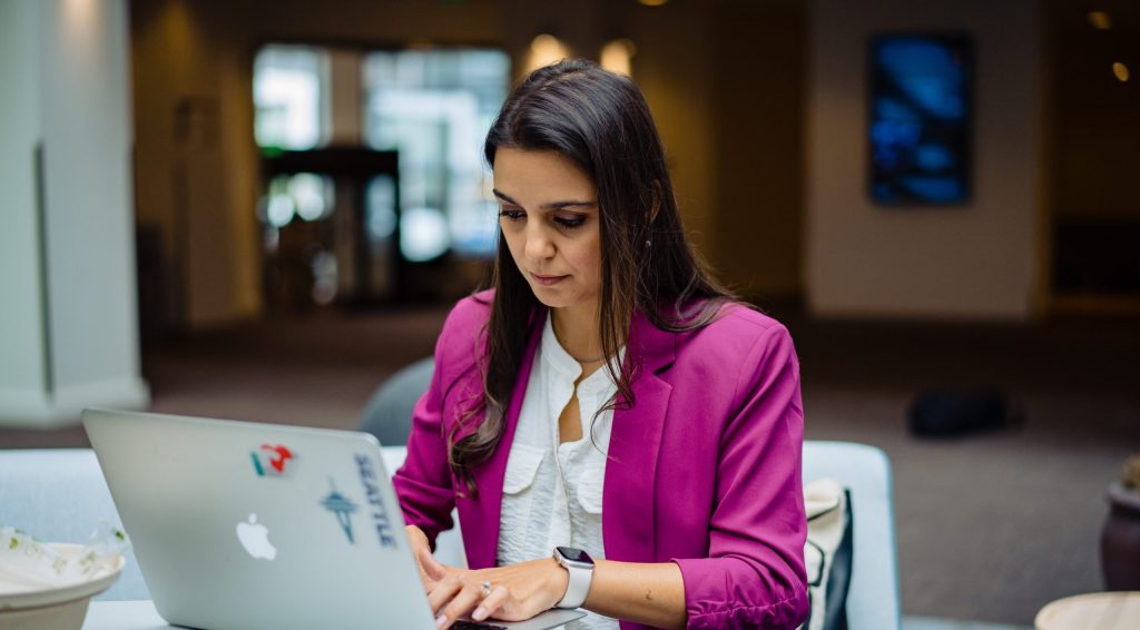 woman working in cybersecurity on laptop