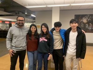 group of international students posing for picture, smiling