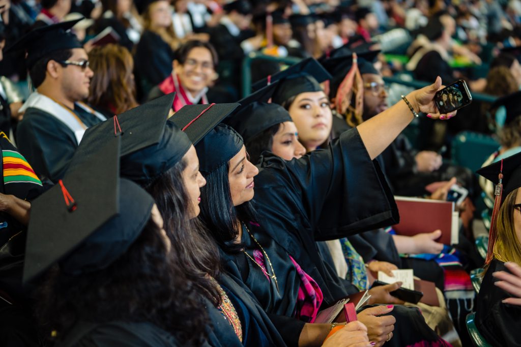 graduates taking a selfie for social media