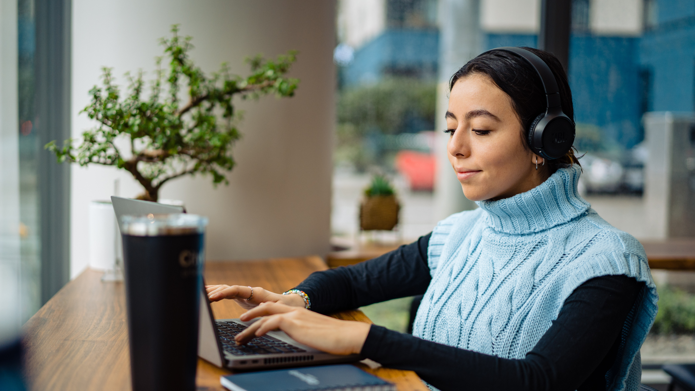 A student enrolled in a general studies degree working on a laptop.