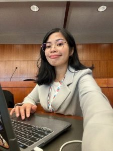 christine sitting and working as part of her student stories spotlight on her trip to DC