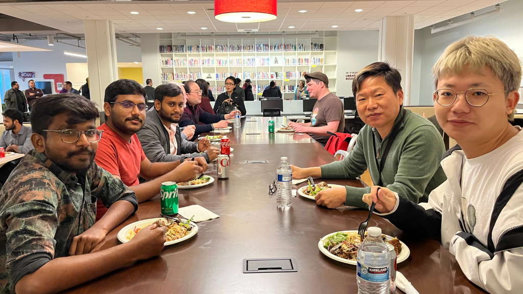 Students sharing BBQ around table