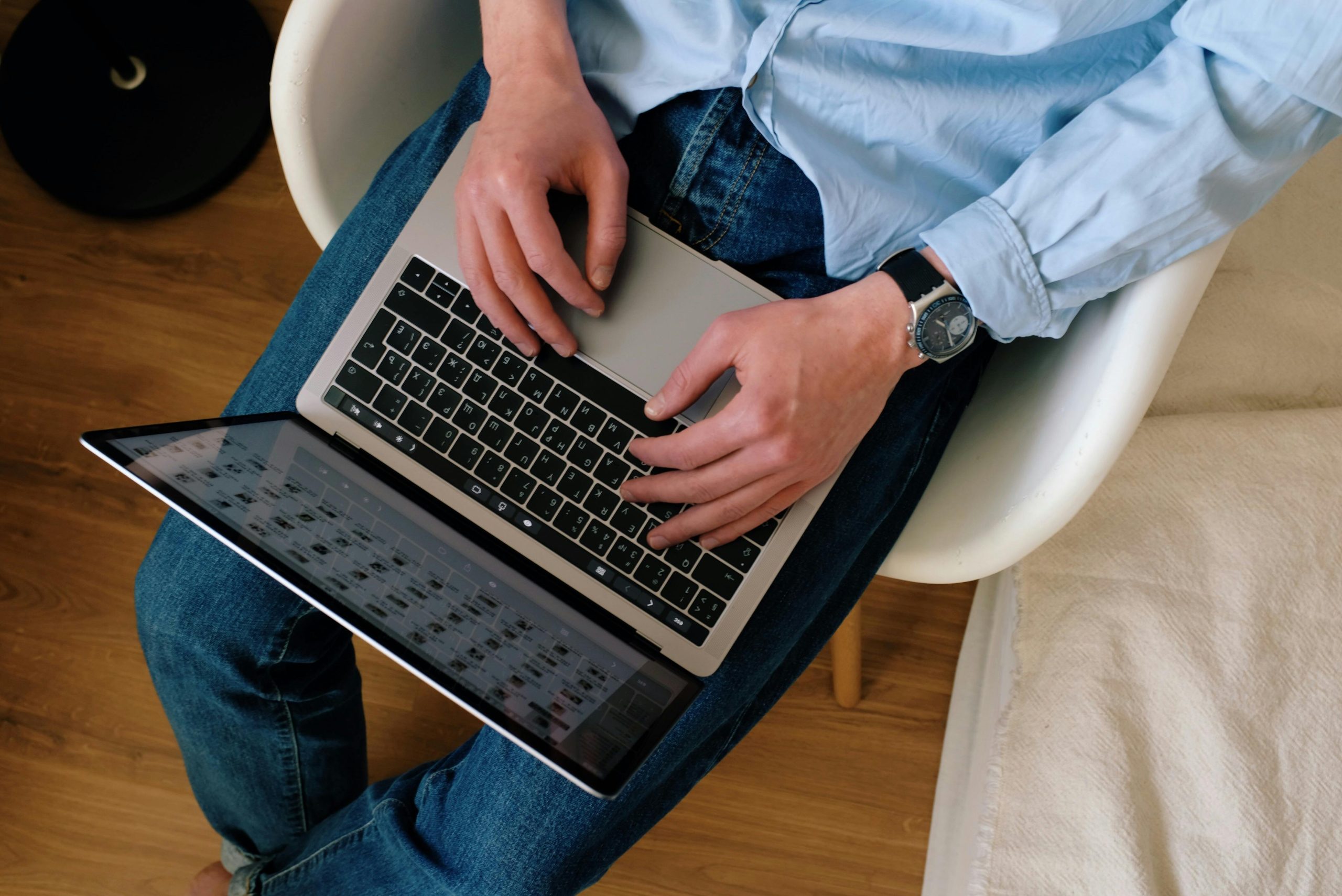Nontraditional student typing on laptop to finish their degree in college.